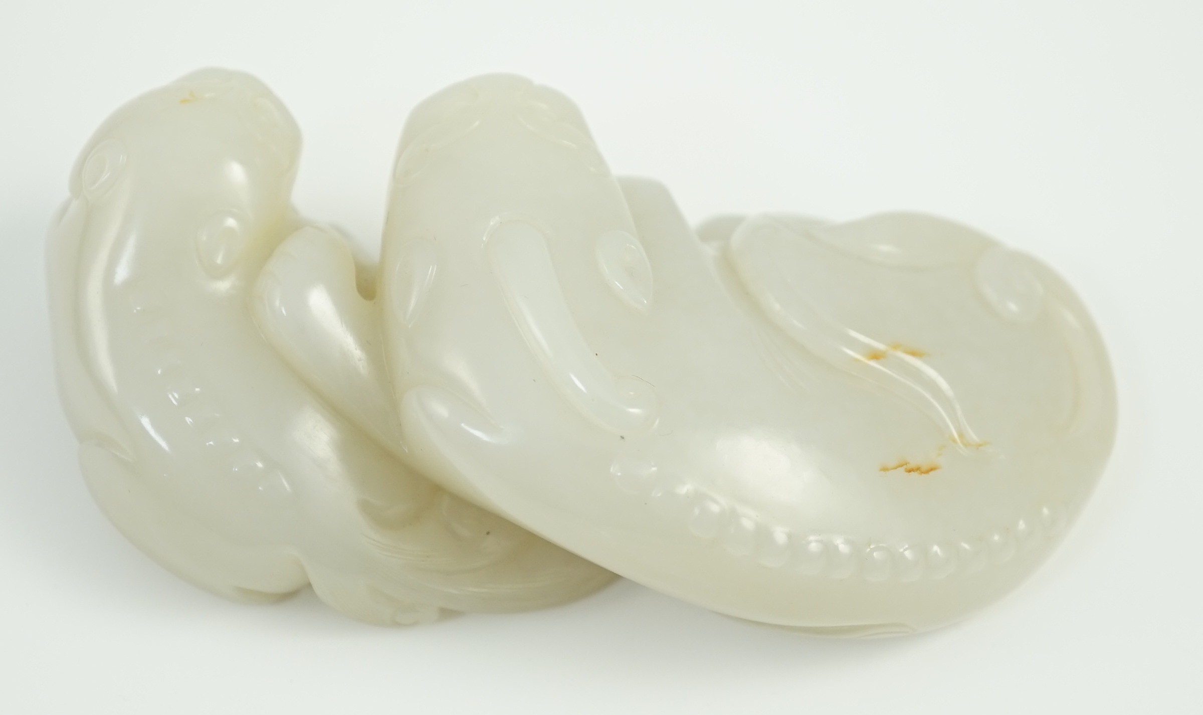A Chinese white jade mythical beast group, 12cm long